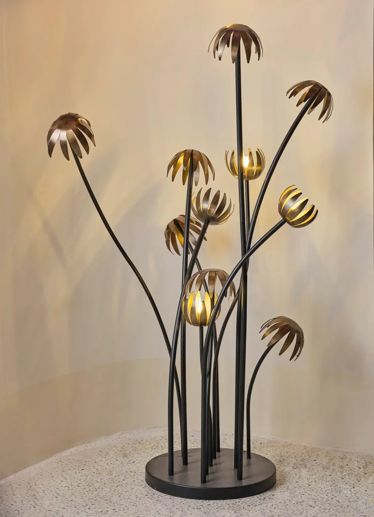 Artistic bouquet floor lamp featuring curved black stems with glowing flower-like heads, designed for ambient modern lighting – Troika designer decor.
