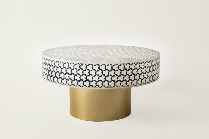 Elegant round mosaic coffee table with black and white tile design.