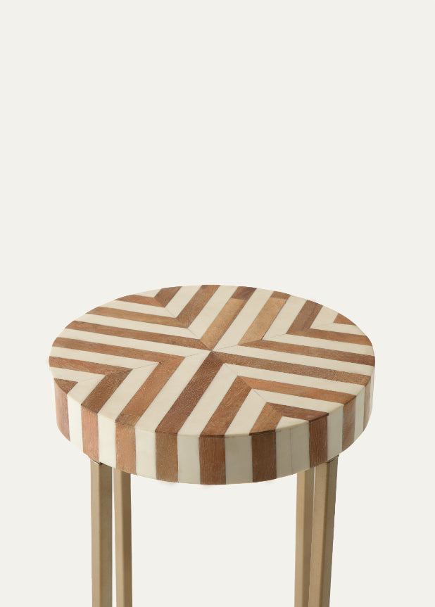 Chevron pattern side table with ivory and wood finish and golden base.