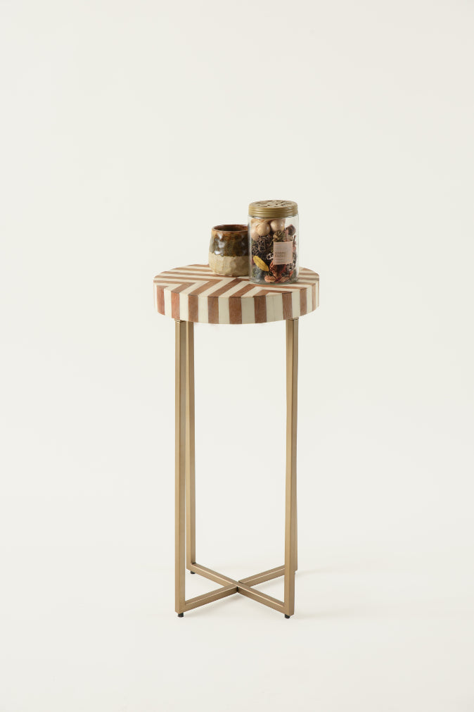 Tall accent table with diagonal inlay design and minimal brass frame.