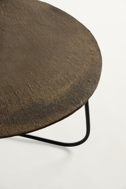Detail shot of raw-edged, hand-textured metal tabletop – rustic industrial coffee table crafted by Troika Life.