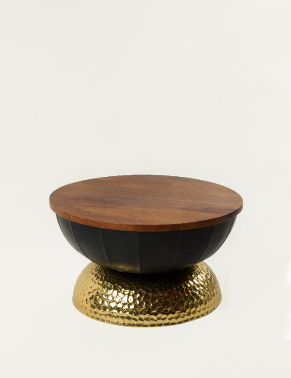Contemporary Valentina coffee table with circular wood surface and bold black-and-gold base – artistic furniture by Troika Life.