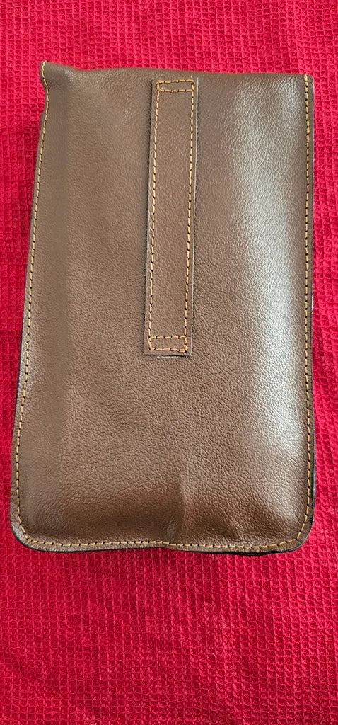 Back side of brown leather tool pouch showing stitched loop for belt or hanging – handcrafted bar accessory case by Troika.
