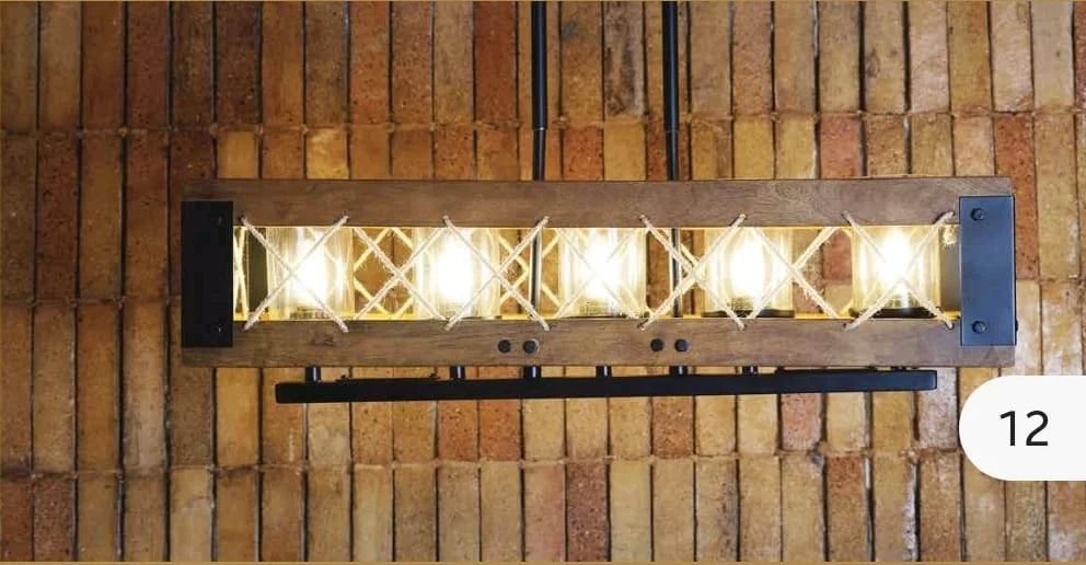 Close-up shot of the lit farmhouse chandelier. The glow enhances the rope detailing and wood texture, emphasizing cozy ambiance.