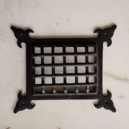 Square vintage-style black cast iron speaker grill cover with grid pattern and ornate corners – handcrafted hardware from Troika.