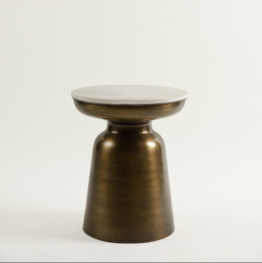 Studio view of Aila side table with marble top and golden bell-shaped base.