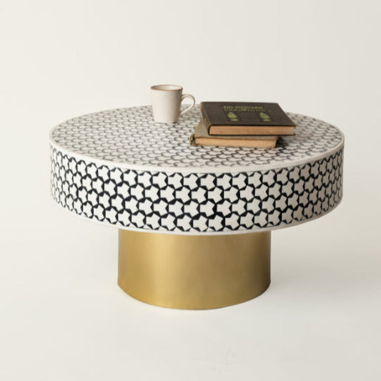 Black and white mosaic coffee table with brass base and cup.