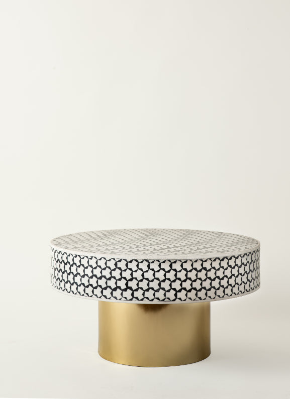 Contemporary mosaic coffee table with geometric patterns and gold base.