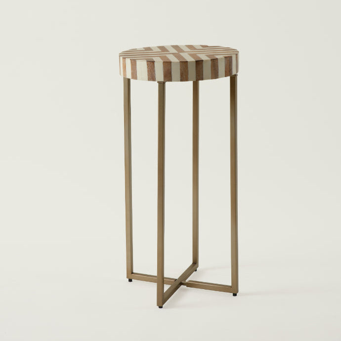 Modern radius side table with striped wooden top and slender brass legs – minimalist accent furniture from Troika Life.