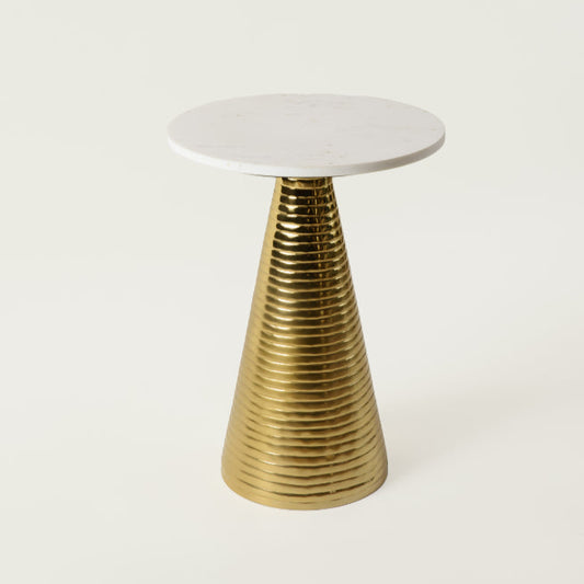 Modern Yves side table featuring a white marble round top and gold ribbed cone base on white background.
