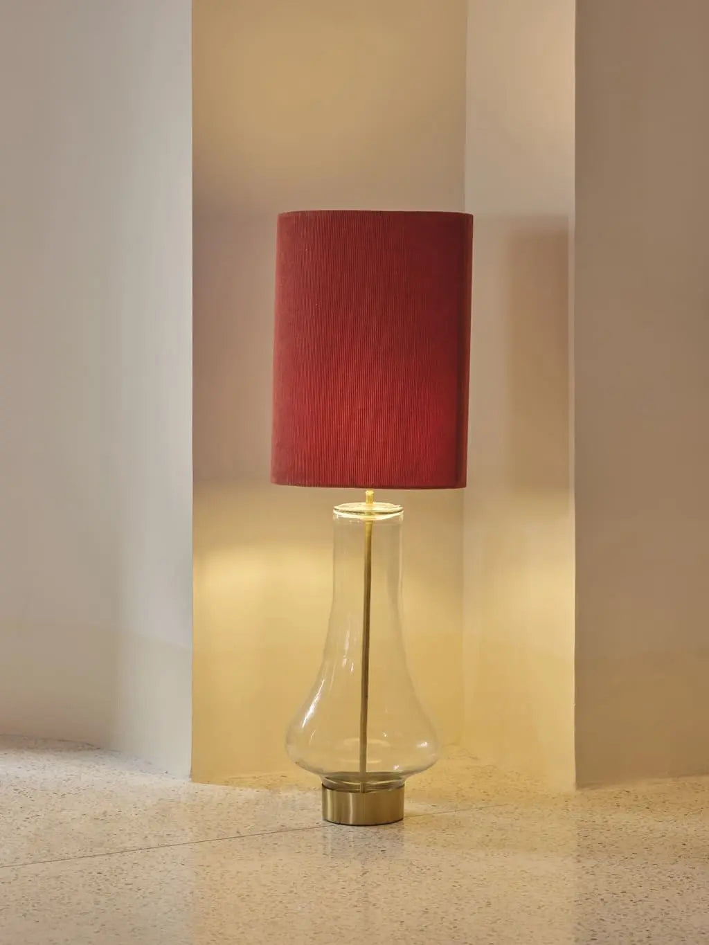 Maya floor lamp with red fabric shade and glass base elegant lighting for modern interiors.
