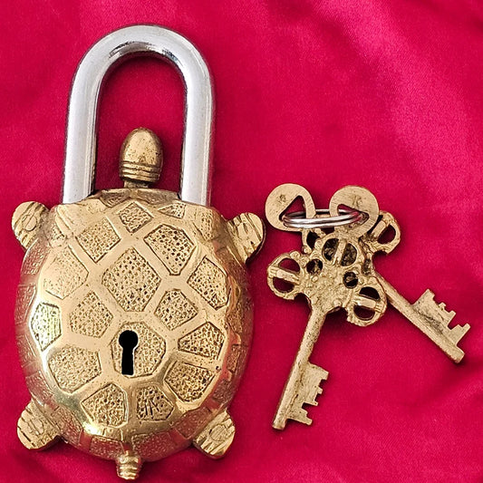 Vintage-style turtle lock with detailed shell pattern, paired with two ornate brass keys