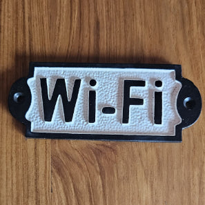 Wi-Fi signage plate in bold black and white cast iron style with vintage charm.